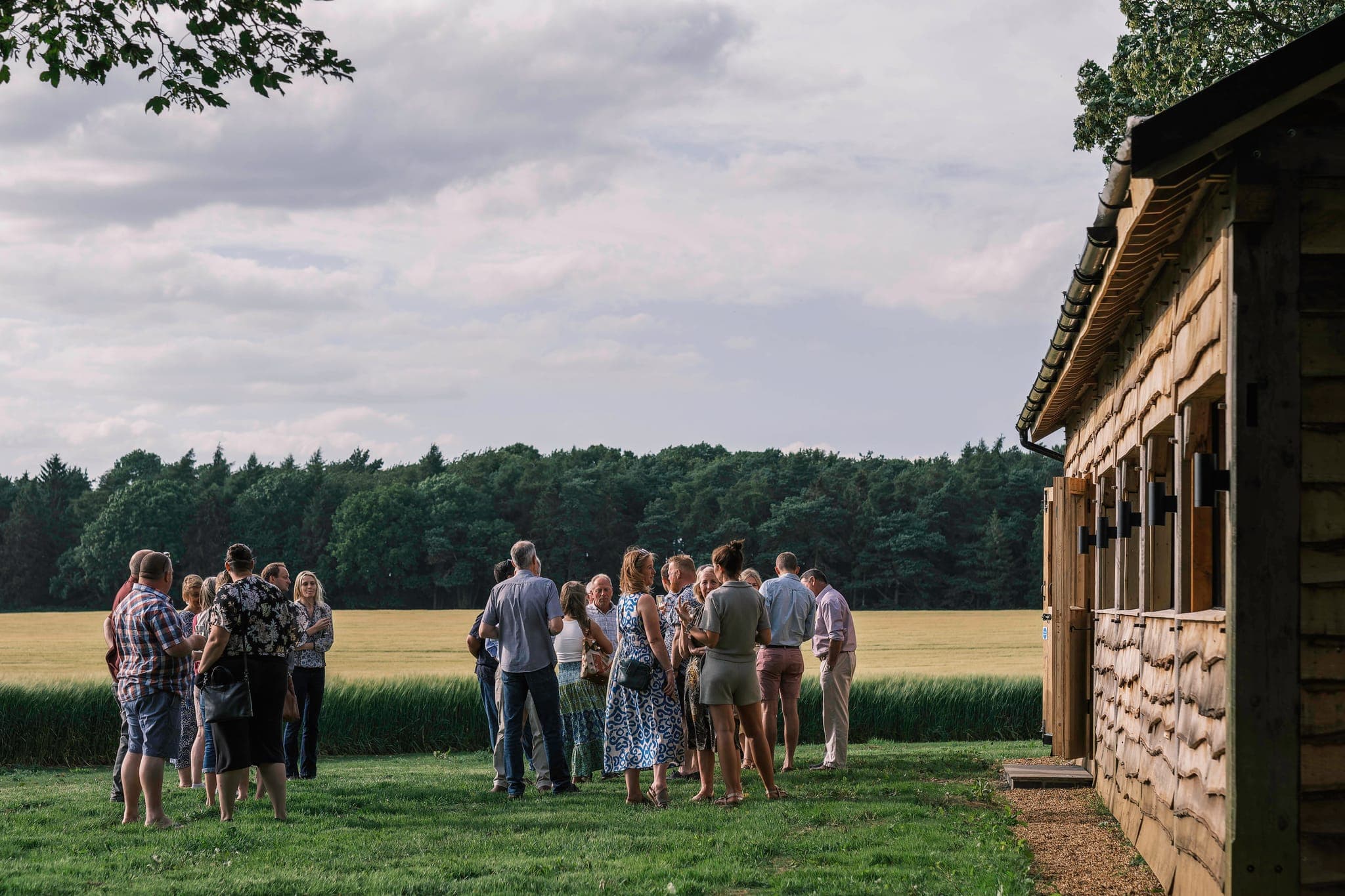 Guests gathered at The Copse on a summer evening.