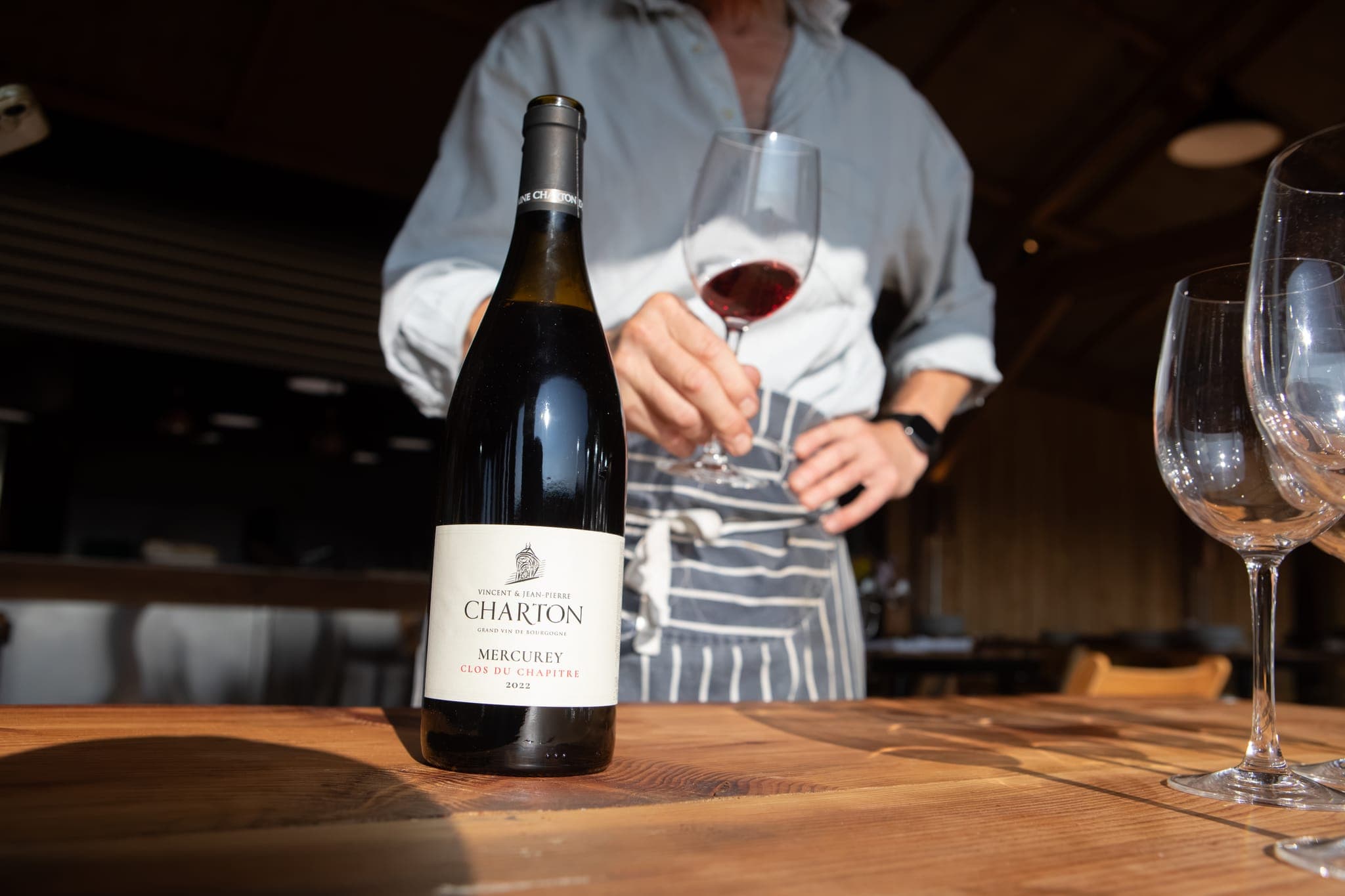 A bottle of Mercurey on the table at The Copse, a poured glass behind it.